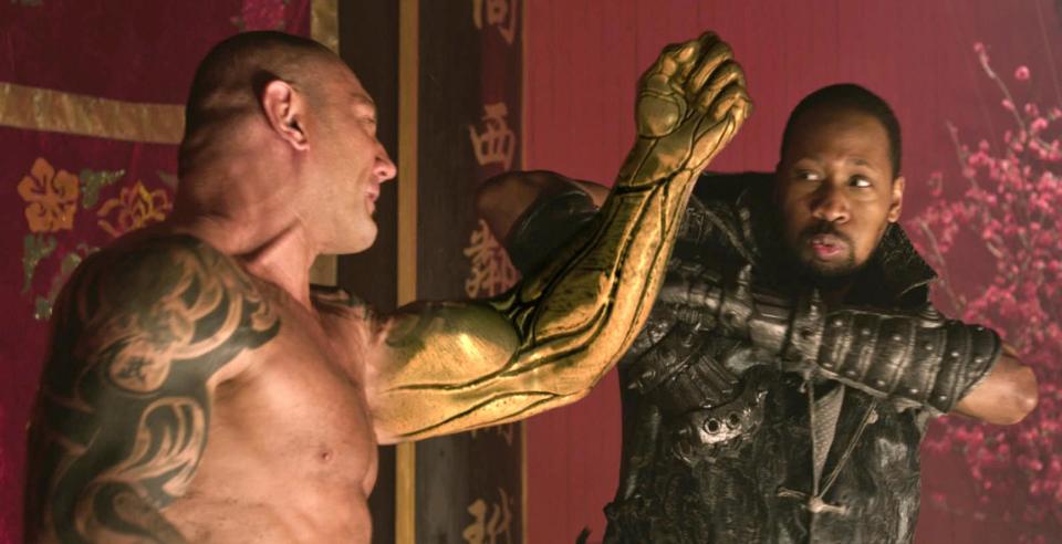 This image released by Universal Pictures shows actor-director RZA, right, in a scene from "The Man With the Iron Fists." (AP Photo/Universal Pictures)