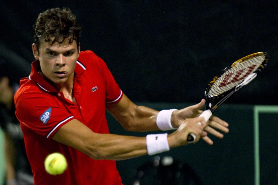 Canadian tennis player Milos Raonic sends the ball to Israel's Amir Weintraub during their Davis Cup match on September 16, 2011 at the Canada stadium in Ramat Hasharon, north of Tel Aviv. Israel is facing Canadian in the Davis Cup world group play-offs between September 16-18 in which the winners advance to World Group in 2012. AFP PHOTO/JACK GUEZ (Photo credit should read JACK GUEZ/AFP/Getty Images)