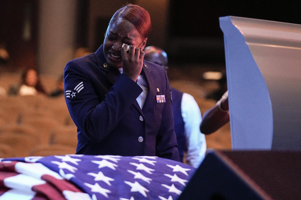 U.S. Air Force personnel stand near the coffin of slain airman Roger Fortson during his funeral at New Birth Missionary Baptist Church, Friday, May 17, 2024, near Atlanta. (AP Photo/Brynn Anderson)