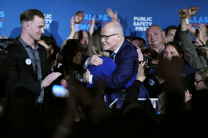 Chicago mayoral candidate Paul Vallas, right, hugs his wife Sharon Vallas as his son Mark Vallas, left, smiles at Paul Vallas' election night event in Chicago, Tuesday, Feb. 28, 2023. Mayor Lori Lightfoot conceded defeat Tuesday night, ending her efforts for a second term and setting the stage for Cook County Commissioner Brandon Johnson to run against former Chicago Public Schools CEO Vallas for Chicago mayor. (AP Photo/Nam Y. Huh)