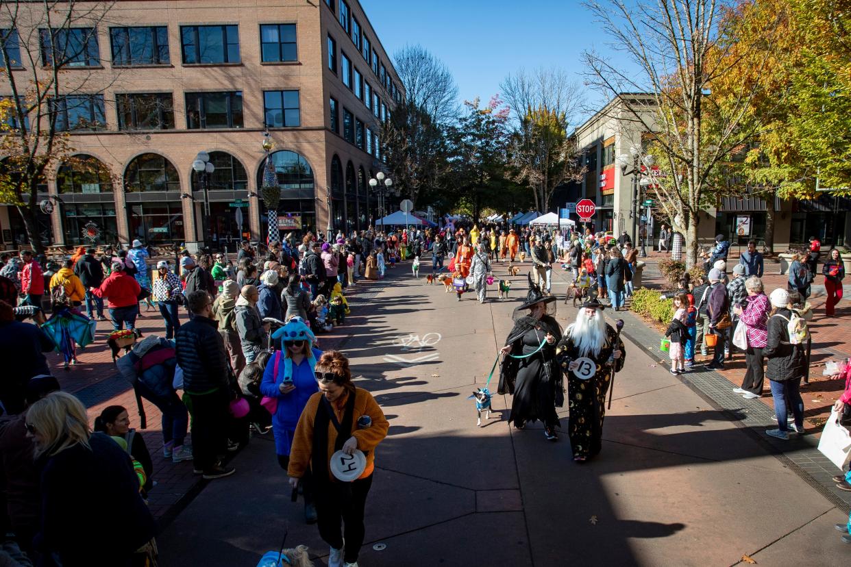 People gather at Kesey Square during a pet parade to kick off Halloween festivities in downtown Eugene in this file photo from 2023. The Eugene Police Department is launching a new program aimed at providing behavioral health and mental health help to people in the downtown area.