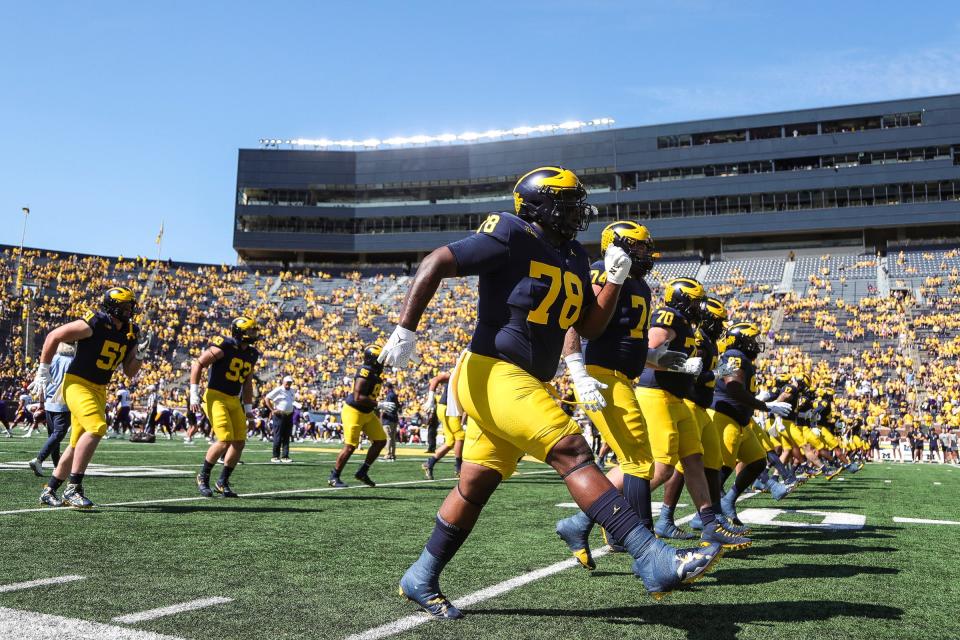 Michigan players warm up before the East Carolina game at Michigan Stadium in Ann Arbor, Saturday, Sept. 2, 2023.