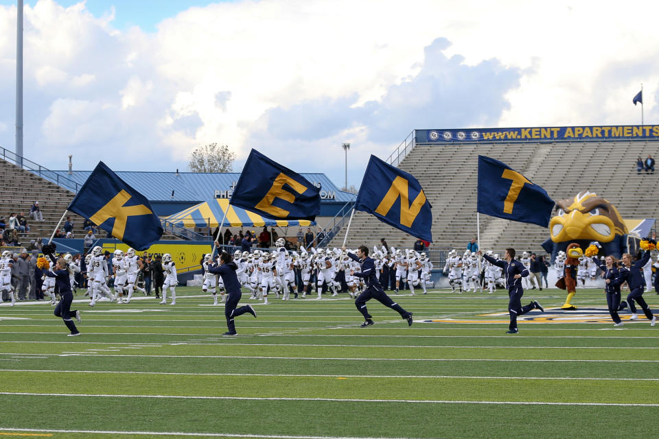 KENT, OH - OCTOBER 20: The Kent State Golden Flashes cheerleaders lead the Golden Flashes on to the field prior to the college football rivalry game between the Akron Zips and Kent State Golden Flashes on October 20, 2018, at Dix Stadium in Kent, OH. Akron Defeated Kent State 24-23 in overtime. (Photo by Frank Jansky/Icon Sportswire via Getty Images)