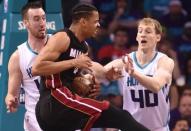 Apr 29, 2016; Charlotte, NC, USA; Miami Heat guard forward Gerald Green (14) gets fouled by Charlotte Hornets forward center Frank Kaminsky (44) during the first half in game six of the first round of the NBA Playoffs at Time Warner Cable Arena. Mandatory Credit: Sam Sharpe-USA TODAY Sports