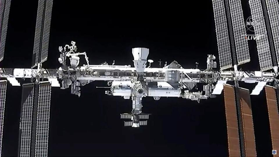 This image made from NASA TV shows the international space station, seen from the SpaceX Crew Dragon spacecraft Saturday, April 24, 2021. ((NASA via AP, File))