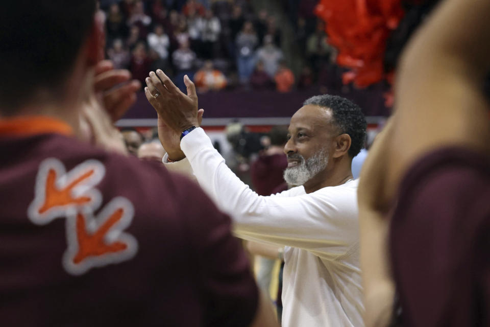 Virginia Tech head coach Kenny Brooks celebrates at the conclusion of an NCAA college basketball game against North Carolina in Blacksburg Va. Sunday Feb. 25, 2024. (Matt Gentry/The Roanoke Times via AP)