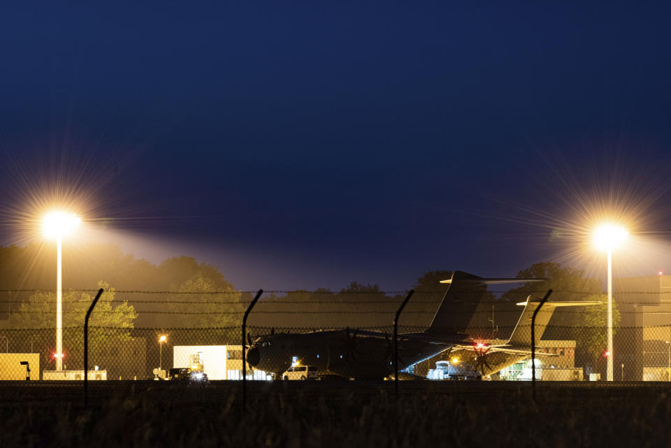 A military transport aircraft, an Airbus A400 M of the German Air Force, stands at the Wunstorf, Germany, air base in Lower Saxony before taking off for Mali, late Friday, June 25, 2021. Germany’s defense minister said on Friday that 12 German troops and a soldier from another country were wounded following an attack on soldiers taking part in a United Nations mission in Mali. (Swen Pf'rtner/dpa via AP)