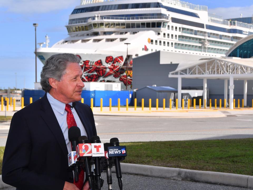 Port Canaveral Chief Executive Officer John Murray answers media questions about COVID-19 and the cruise industry, while standing outside Cruise Terminal 10. Behind him is the Norwegian Gem, which was making a port-of-call stop at the port on Wednesday.