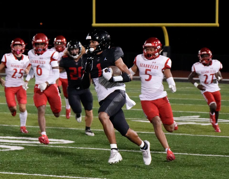 New Smyrna's Armoni Spurlock (1) runs the kickoff back for a TD during Kickoff Classic at New Smyrna Beach Sports Complex, Friday, Aug.18, 2023.