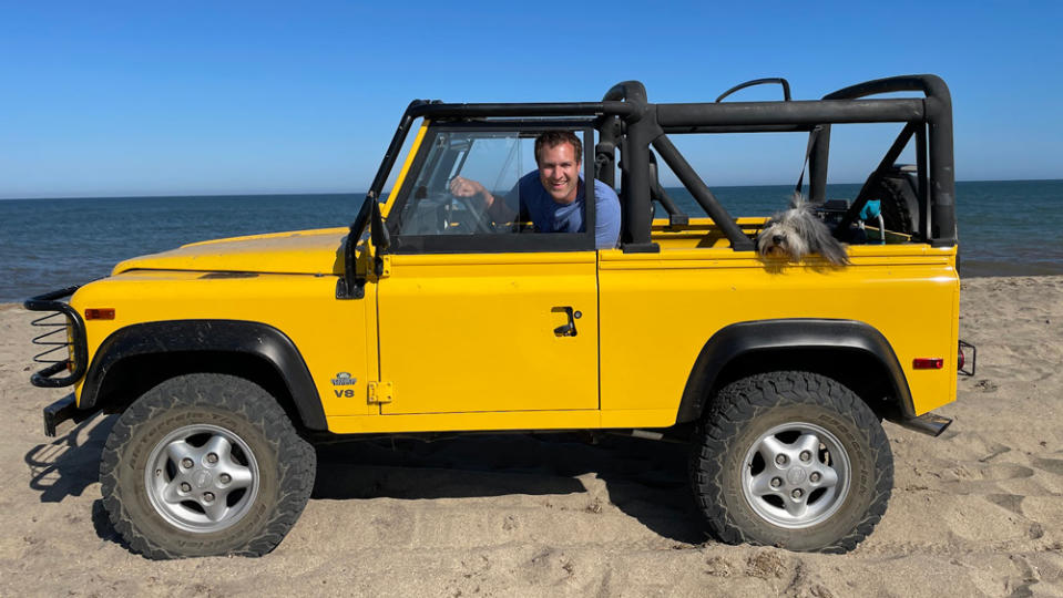 Automotive personality Doug DeMuro and his dog Noodle spending quality time with their Land Rover. 