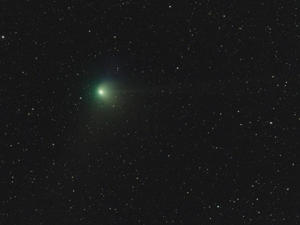 Comet ZTF is shown against the night sky.