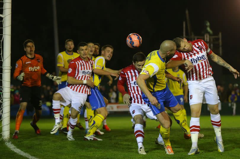 Warrington Town's Craig Robinson (second right) scores the first and only goal as the club beat Exeter City, 100 league places above them, in the FA Cup first round, 2014 -Credit:Dave Thompson/PA Wire
