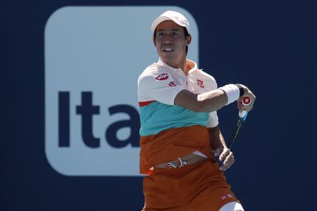 Mar 22, 2019; Miami Gardens, FL, USA; Kei Nishikori of Japan hits a forehand against Dusan Ljovic of Serbia (not pictured) in the second round of the Miami Open at Miami Open Tennis Complex. Mandatory Credit: Geoff Burke-USA TODAY Sports