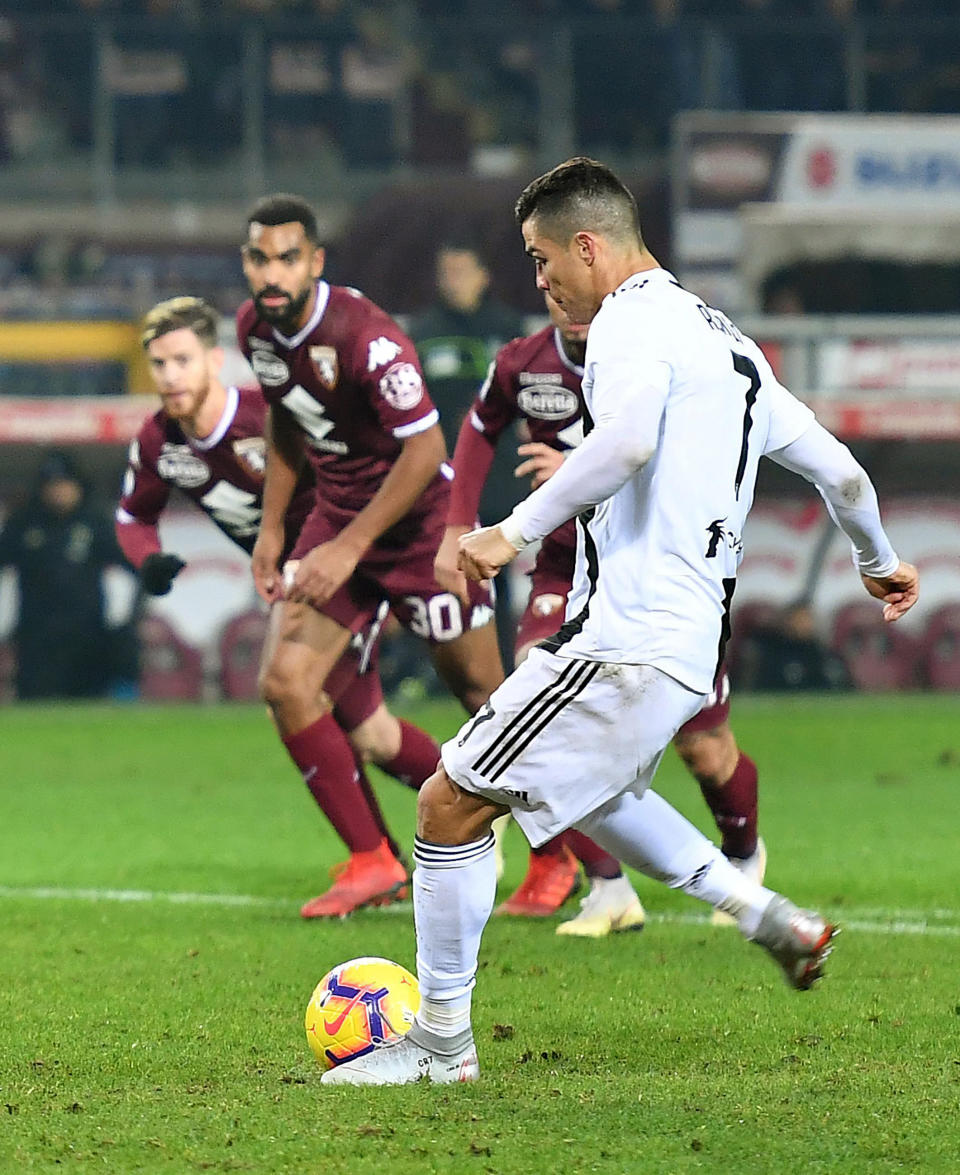 Juventus' Cristiano Ronaldo scores during the Italian Serie A soccer match against Torino FC at the Olimpico stadium in Turin, Italy, Saturday Dec. 15, 2018 (Alessandro Di Marco/ANSA via AP)