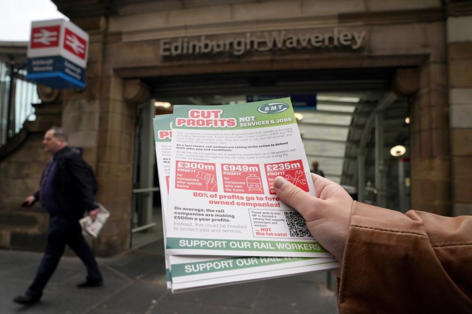 Members of the RMT picket at the entrance to Waverley station in Edinburgh (Andrew Milligan/PA) (PA Wire)