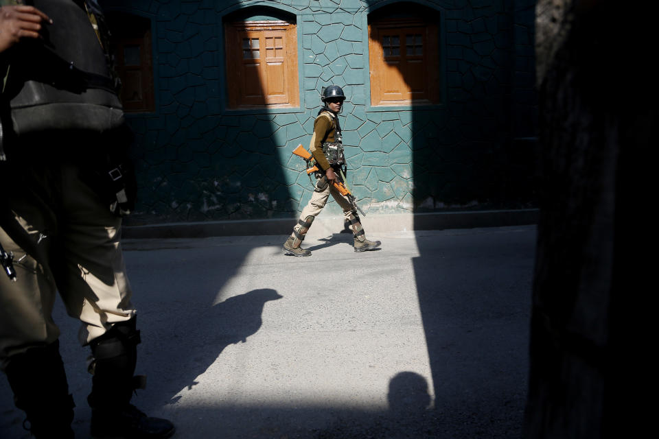 Indian paramilitary soldier patrol during a strike in Srinagar, Indian controlled Kashmir, Monday, Oct. 22, 2018. Armed soldiers and police have fanned out across much of Indian-controlled Kashmir as separatists challenging Indian rule called for a general strike to mourn the deaths of civilians and armed rebels during confrontation with government forces. (AP Photo/Mukhtar Khan)