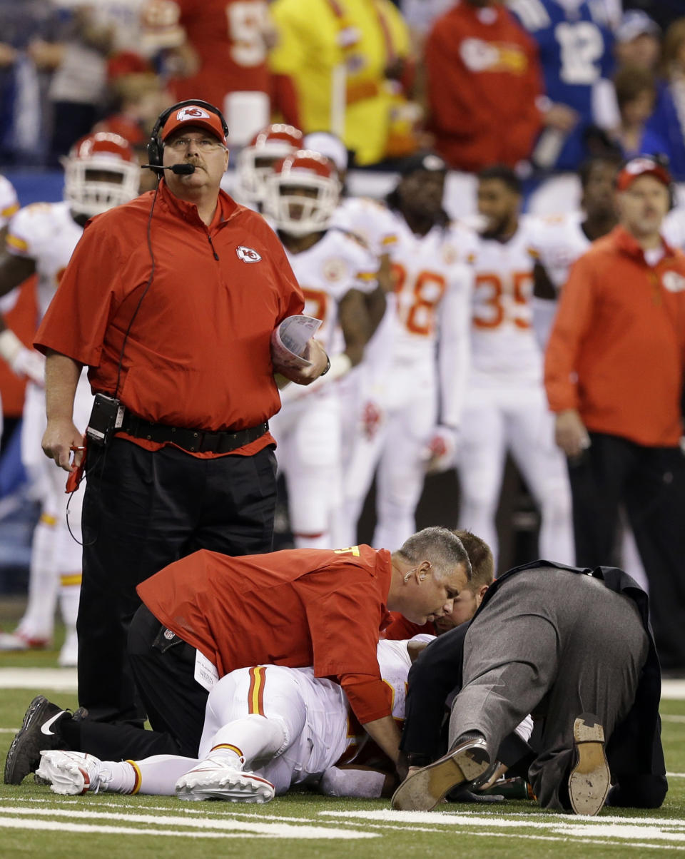 Kansas City Chiefs running back Jamaal Charles (25) is looked at by trainers after going down against the Indianapolis Colts during the first half of an NFL wild-card playoff football game Saturday, Jan. 4, 2014, in Indianapolis. (AP Photo/Darron Cummings)