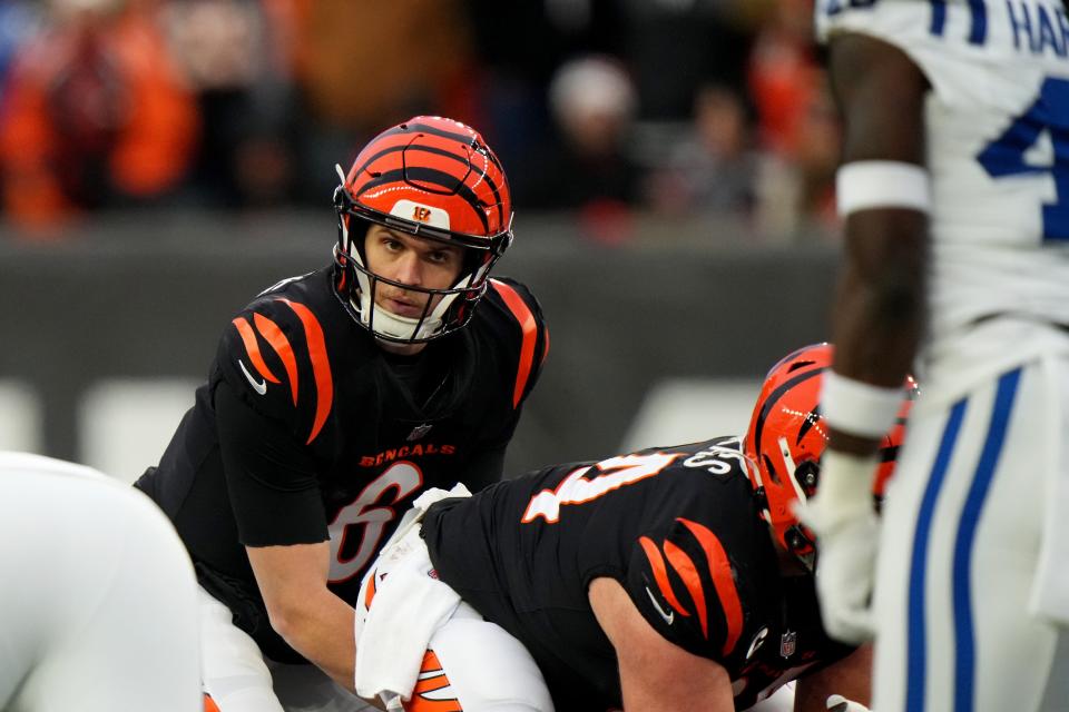 Cincinnati Bengals quarterback <a class="link " href="https://sports.yahoo.com/nfl/players/32138" data-i13n="sec:content-canvas;subsec:anchor_text;elm:context_link" data-ylk="slk:Jake Browning;sec:content-canvas;subsec:anchor_text;elm:context_link;itc:0">Jake Browning</a> (6) checks the position of Indianapolis Colts safety Ronnie Harrison Jr. (48) in the fourth quarter during a Week 14 NFL game between the Indianapolis Colts and the Cincinnati Bengals, Sunday, Dec. 10, 2023, at Paycor Stadium in Cincinnati.