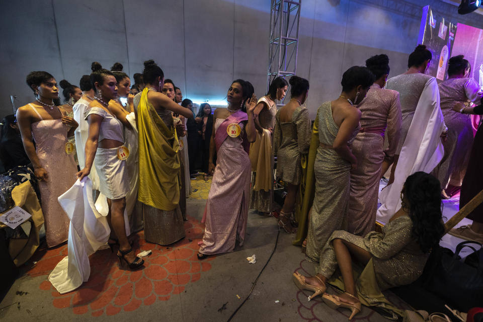 Contestants wait to compete for the Miss Trans Northeast 22, beauty pageant in Guwahati, India, Wednesday, Nov. 30, 2022. In a celebration of gender diversity and creative expression, a beauty pageant in eastern Indian state of Assam brought dozens of transgender models on stage in Guwahati. Sexual minorities across India have gained a degree of acceptance especially in big cities and transgender people were given equal rights as a third gender in 2014. But prejudice against them persists and the community continues to face discrimination and rejection by their families. (AP Photo/Anupam Nath)