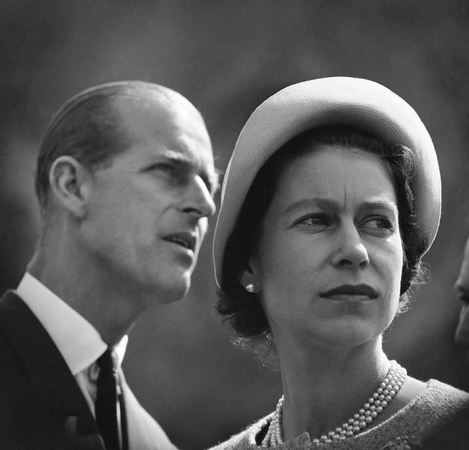 FILE - In this June 20, 1959 file photo, Britain's Queen Elizabeth and Prince Philip are pictured in Schefferville, as they listen to an explanation on the workings of an iron ore mine on another stop in their royal tour of Canada. Buckingham Palace officials say Prince Philip, the husband of Queen Elizabeth II, has died, it was announced on Friday, April 9, 2021. He was 99. Philip spent a month in hospital earlier this year before being released on March 16 to return to Windsor Castle. Philip, also known as the Duke of Edinburgh, married Elizabeth in 1947 and was the longest-serving consort in British history. (AP Photo/File)