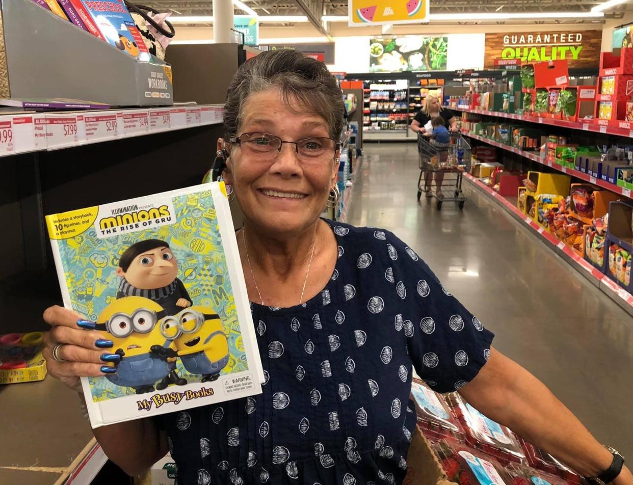 Aldi fan Cheryl Van Dyke poses for a photo in the Aisle of Shame in Chester. "I'm shameful because I'm getting this book right now," Van Dyke quipped.