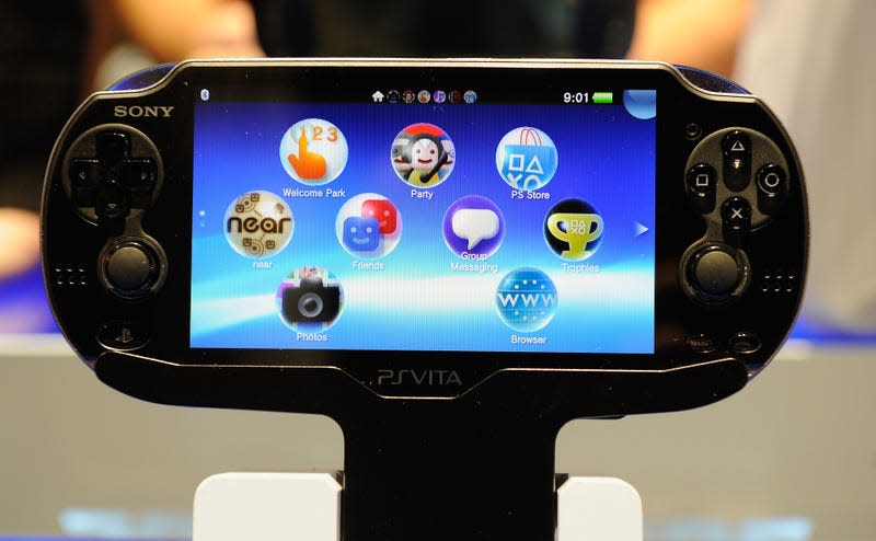 A PS Vita is displayed in a showroom. 