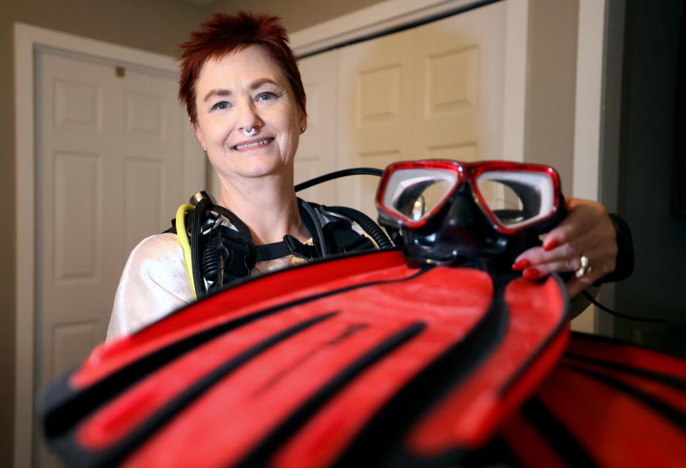 Amanda Jenson shows her scuba diving gear at her home in Murray on Monday, June 12, 2023. Jenson is planning a scuba diving trip to Mexico. | Kristin Murphy, Deseret News