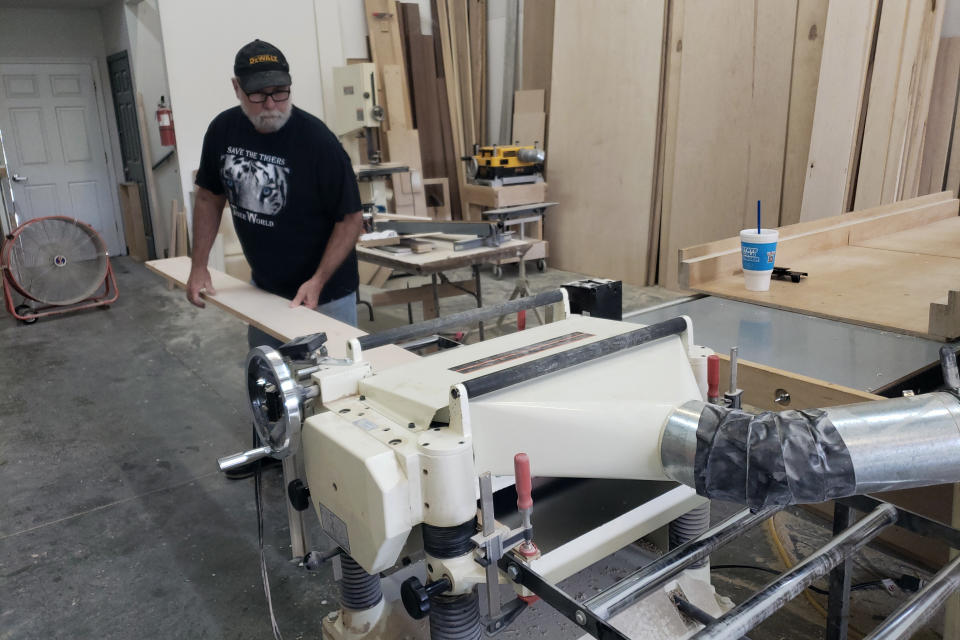 Bill Albritton of Bill Albritton Cabinetry in his workshop in Charlotte, N.C., on Aug. 24, 2022. Albritton is booked out 30 days in advance, compared to the usual 90 to 160 days. Meanwhile, his costs have gone up by more than 30% across the board. Plywood he uses jumped from $72 to $140 a sheet around Christmas. It has gone back down to $85 a sheet, but that’s still higher than it used to be. And he has trouble finding hinges at any price. (Rick Chastain/Courtesy of Bill Albritton via AP)