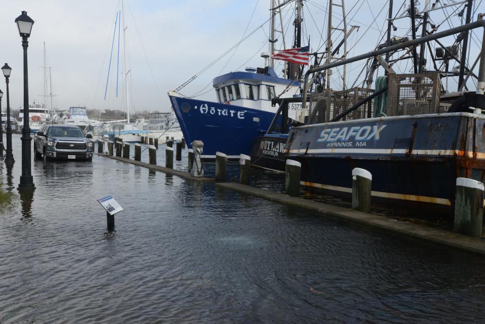 A wind-driven high tide floods into the Ocean Street Docks in Hyannis.