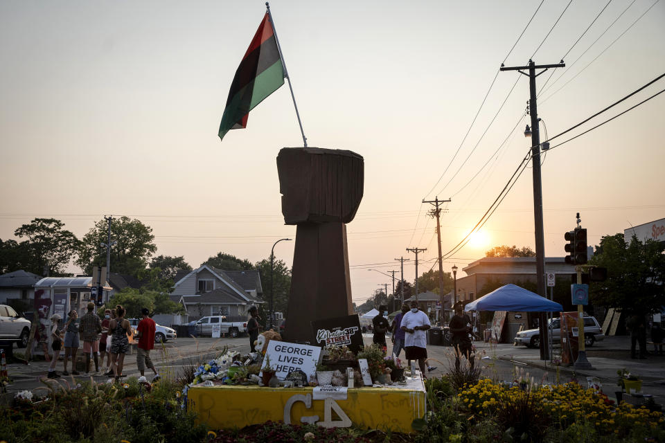Three months after George Floyd was killed by the police, people visit the memorial set up in his memory in Minneapolis on Aug. 25, 2020 (Ed Ou / NBC News)