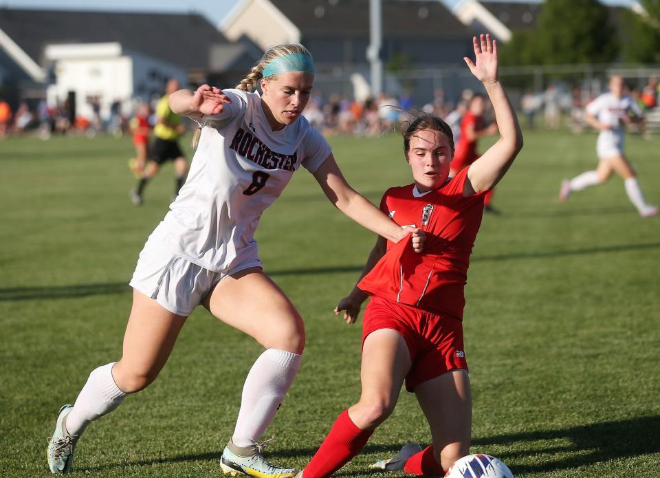 Rochester's Abby Jerszynski, left, and Chatham Glenwood's Savannah Bell battle for the ball during the first half of the Class 2A Normal West girls soccer sectional final on Friday, May 26, 2023.