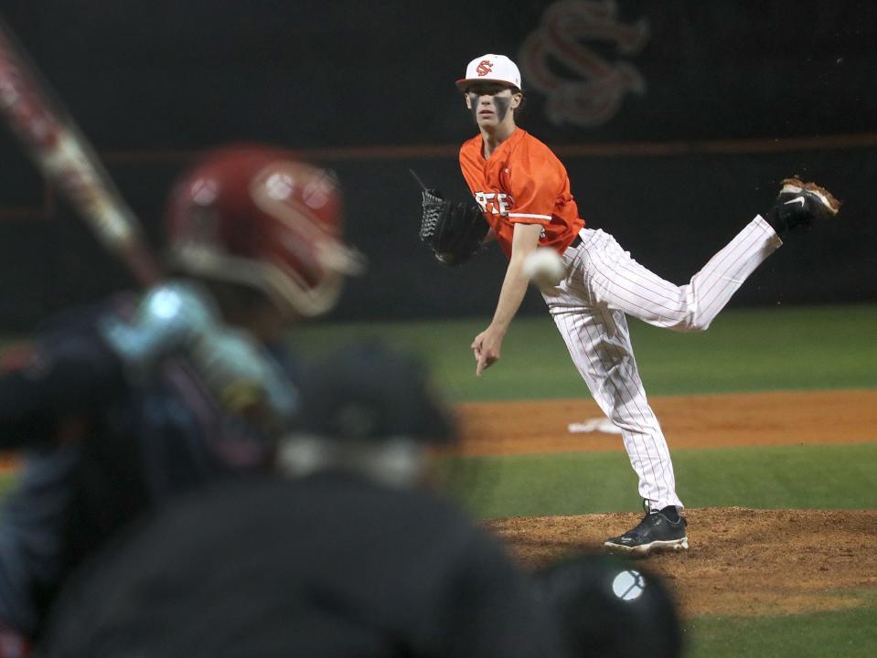 Spruce Creek's Cooper West (4) throws a pitch against Seabreeze, Thursday, Feb. 29, 2024 at Spruce Creek High School.