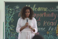 Former U.S. first lady Michelle Obama speaks to female students at Can Giuoc high school in Long An province, Vietnam Monday, Dec. 9, 2019. Obama is on a visit to Vietnam to promote education for adolescent girls. (AP Photo/Hau Dinh)