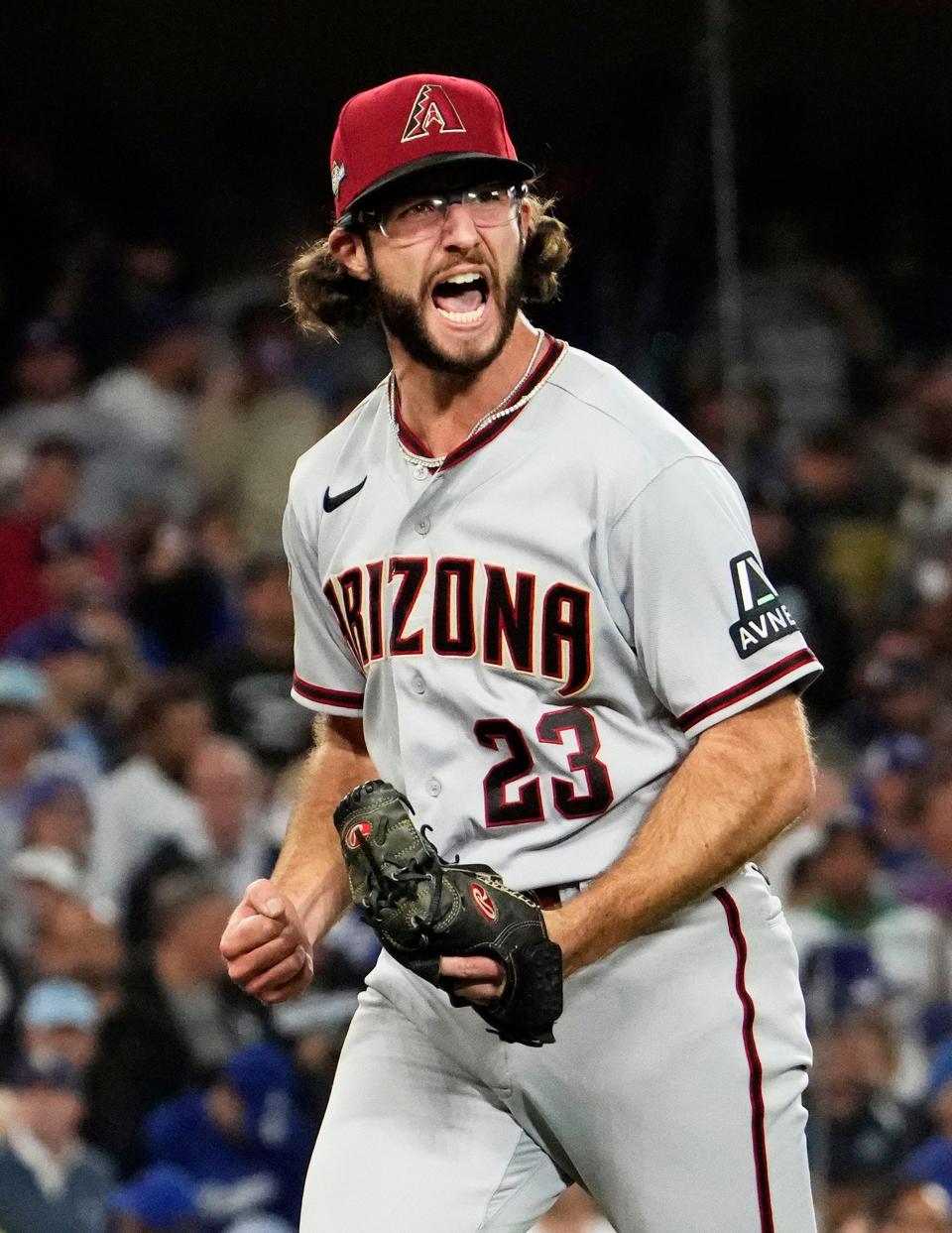 Arizona Diamondbacks starting pitcher Zac Gallen (23) reacts after striking out Los Angeles Dodgers Freddie Freeman (5) with the bases loaded in the fifth inning during Game 2 of the NLDS at Dodger Stadium on Oct 9, 2023.