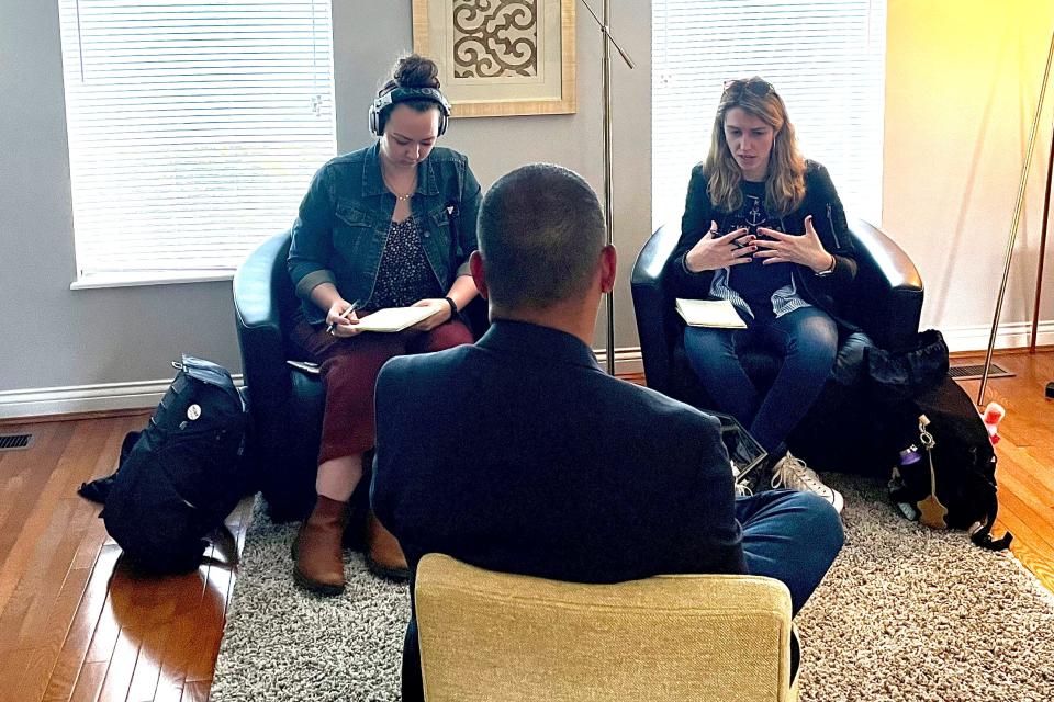 Dispatch reporters Sheridan Hendrix, left, and Céilí Doyle, right, interview Randy Sroufe, center, at his home in Cincinnati, Ohio on Wednesday, May 12, 2021.