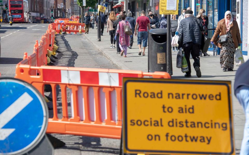 Pavement on Camden High Street that has been widened to help social distancing - Paul Grover for the Telegraph/Paul Grover