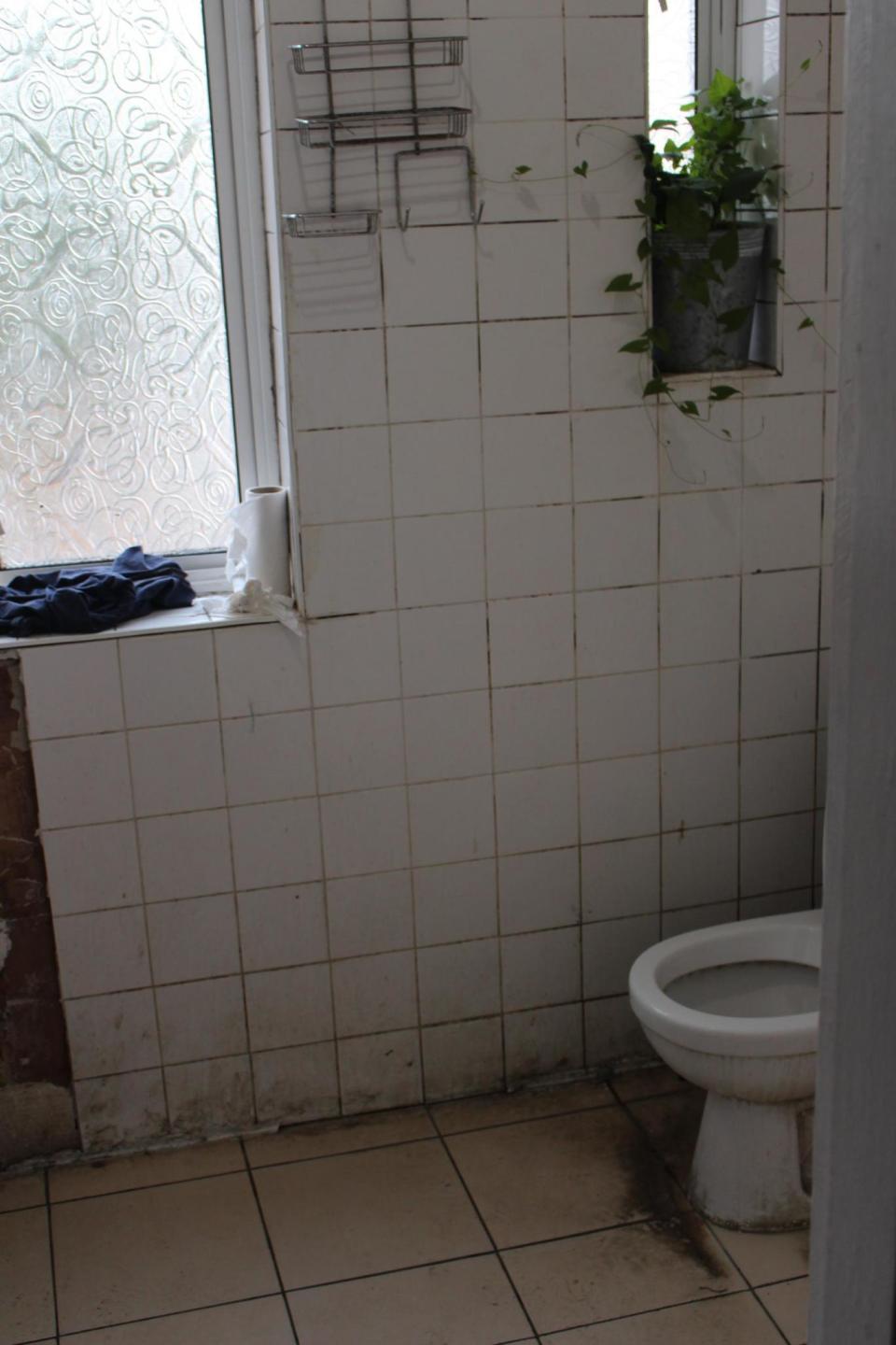 The disgusting bathroom used by the 16 men found in the flat (Brent Council)