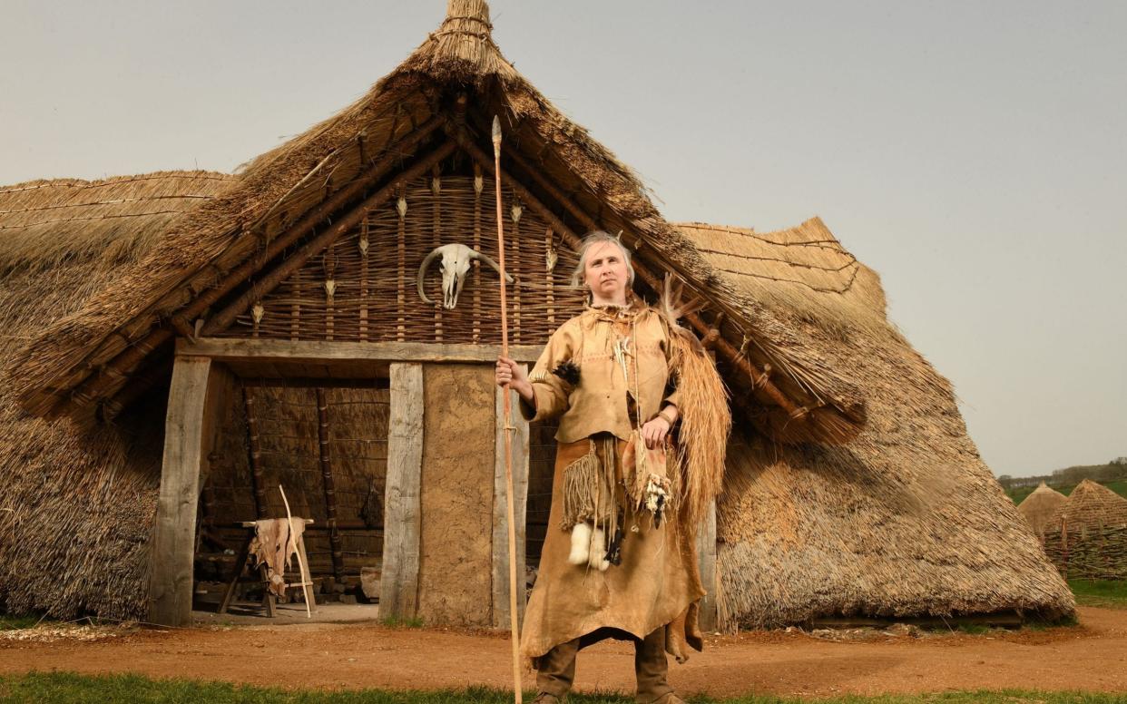 The Stone Age home built at Butser Ancient Farm in the Hampshire South Downs - RUSSELL SACH FOR THE TELEGRAPH