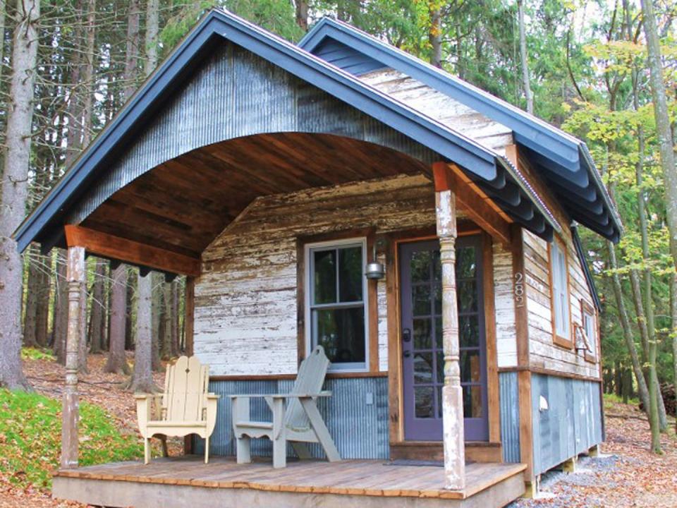 <p>One of 14 tiny cabins at the <a href="https://bluemoonrising.org/" rel="nofollow noopener" target="_blank" data-ylk="slk:Blue Moon Rising ecotourism retreat;elm:context_link;itc:0;sec:content-canvas" class="link ">Blue Moon Rising ecotourism retreat</a> in McHenry, Maryland, the 250-square foot Kaya has a rustic reclaimed metal and wood exterior. Built by the folks at <a href="http://www.hobbitatspaces.com" rel="nofollow noopener" target="_blank" data-ylk="slk:Hobbitat;elm:context_link;itc:0;sec:content-canvas" class="link ">Hobbitat</a>, the quaint interior features a living space, queen-bed nook, bathroom, and kitchen with a view of nature, all under a curved, corrugated metal ceiling. Rental rates per night range from $249 to $349.<br></p><p><a class="link " href="https://go.redirectingat.com?id=74968X1596630&url=https%3A%2F%2Fwww.tripadvisor.com%2FHotel_Review-g41261-d5535285-Reviews-Blue_Moon_Rising-McHenry_Garrett_County_Maryland.html&sref=https%3A%2F%2Fwww.countryliving.com%2Fhome-design%2Fg1887%2Ftiny-house%2F" rel="nofollow noopener" target="_blank" data-ylk="slk:PLAN YOUR TRIP;elm:context_link;itc:0;sec:content-canvas">PLAN YOUR TRIP</a> <a class="link " href="https://bluemoonrising.org/cabin-rentals/kaya/" rel="nofollow noopener" target="_blank" data-ylk="slk:SEE INSIDE;elm:context_link;itc:0;sec:content-canvas">SEE INSIDE</a></p>