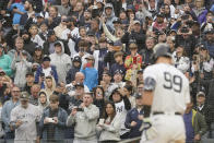 Fanns react as New York Yankees' Aaron Judge comes up to bat in the fourth inning of a baseball game against the Baltimore Orioles, Saturday, Oct. 1, 2022, in New York. (AP Photo/Mary Altaffer)