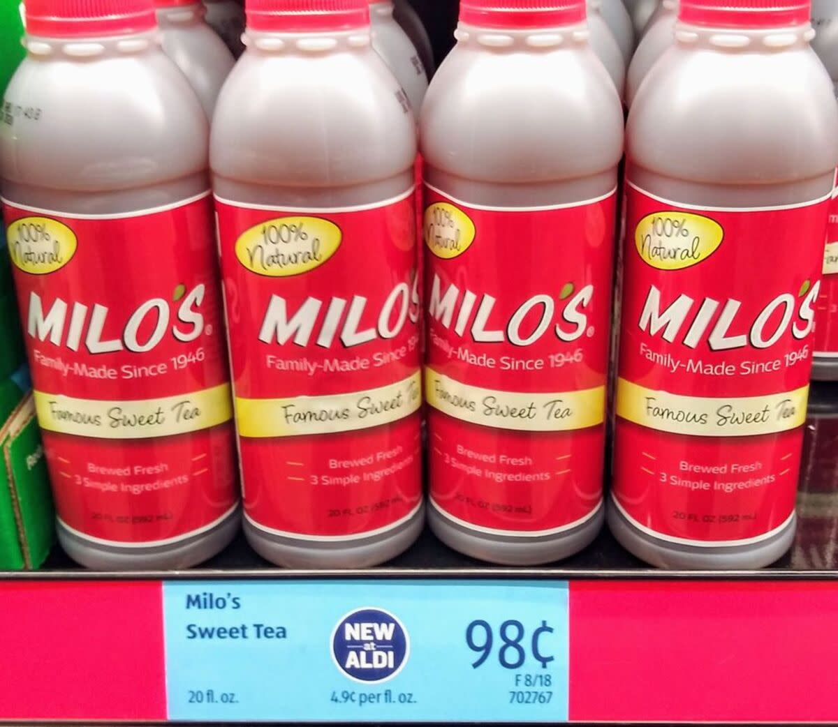 Several bottles of Milo’s Sweet Tea, 20 fl. oz. with a blue price tag at Aldi, Temple, Texas, in the refrigerated section