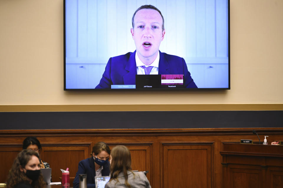 FILE - In this July 29, 2020 file photo, Facebook CEO Mark Zuckerberg testifies remotely during a House Judiciary subcommittee on antitrust on Capitol Hill, in Washington. The term metaverse seems to be everywhere. Facebook is hiring thousands of engineers in Europe to work on it, while video game companies are outlining their long-term visions for what some consider the next big thing on the internet. Essentially, it’s a world of endless, interconnected virtual communities where people can meet, work and play. You can go to a virtual concert, take a trip online and try on digital clothing. But tech companies still have to figure out how to connect their online platforms. (Mandel Ngan/Pool via AP)