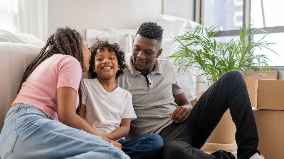 happy black family in their new home