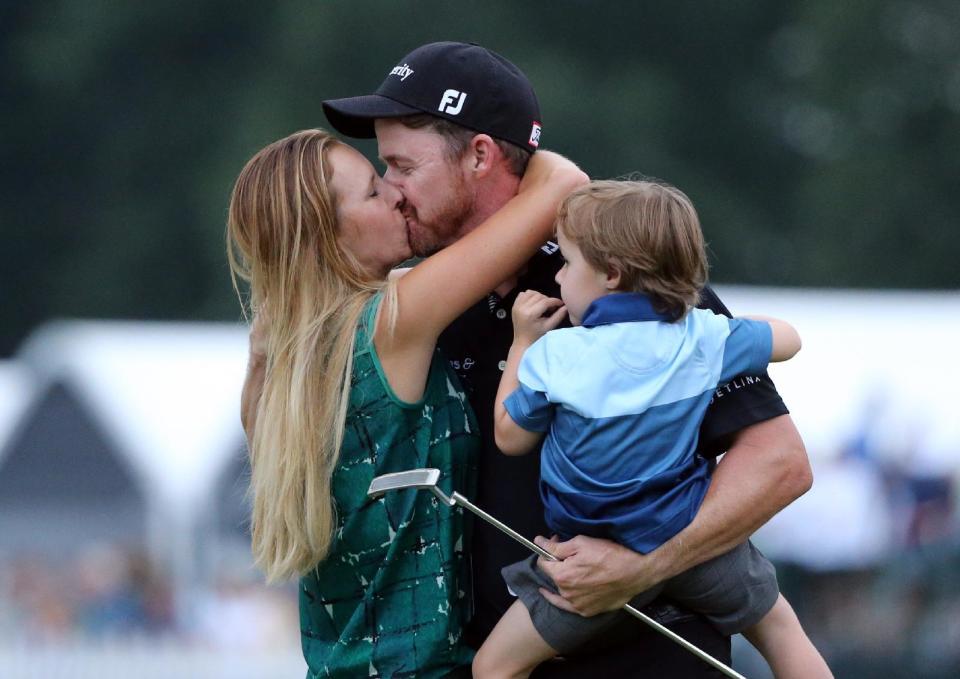 Jimmy Walker celebrates with his wife Erin, left, and son Beckett after winning the PGA Championship. (AP)