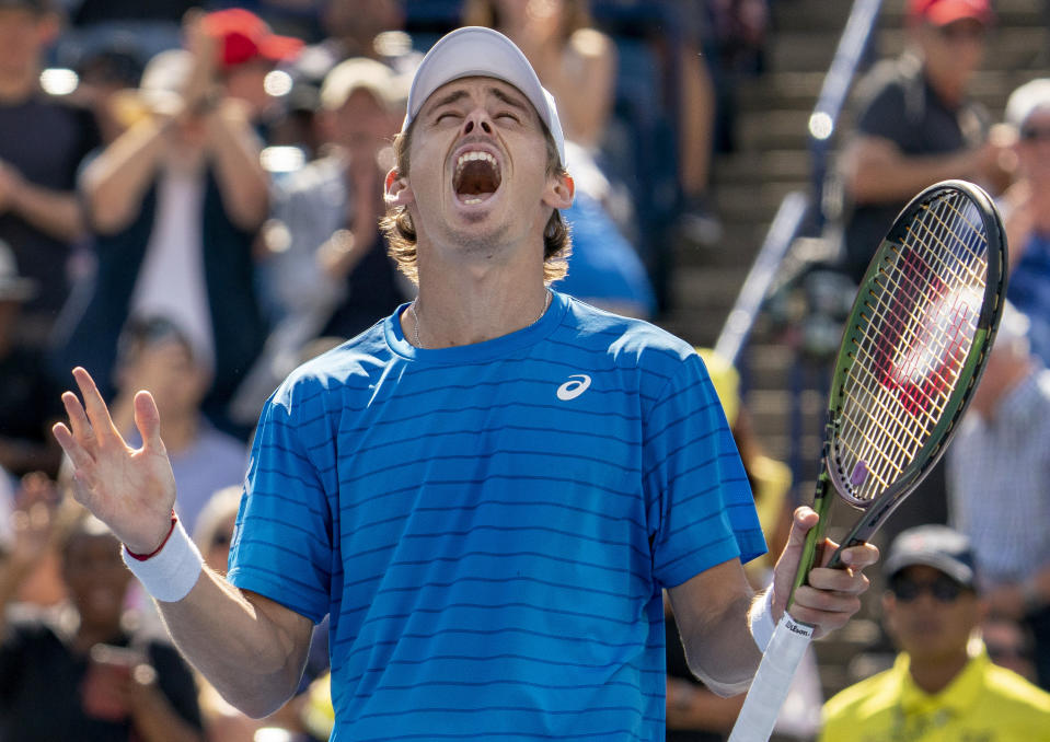 Alex de Minaur, of Australia, celebrates sfter his win over Alejandro Davidovich Fokina, of Spain, in men's tennis match action at the National Bank Open in Toronto, Saturday, Aug. 12, 2023. (Spencer Colby/The Canadian Press via AP)