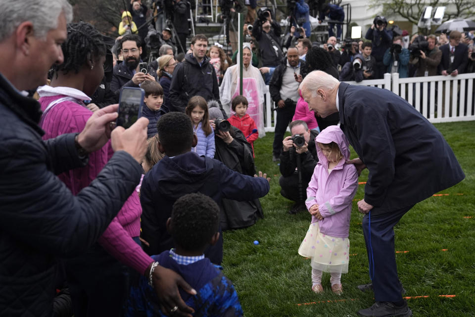 President Joe Biden, right, greets children at the White House Easter Egg Roll on the South Lawn of the White House, Monday, April 1, 2024, in Washington. (AP Photo/Evan Vucci)