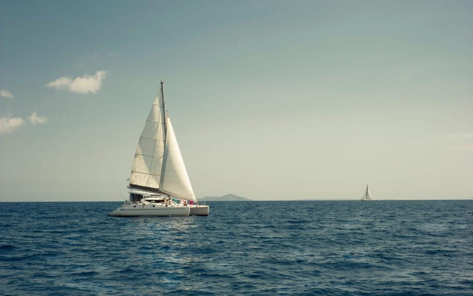 Catamaran sailboat with two sails sailing on Sporades Islands, Greece - Alamy 