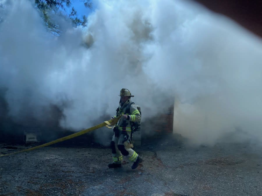 A firefighter at the Eagle Lane house fire in Suffolk on April 26, 2024 (Courtesy of Suffolk Fire & Rescue)