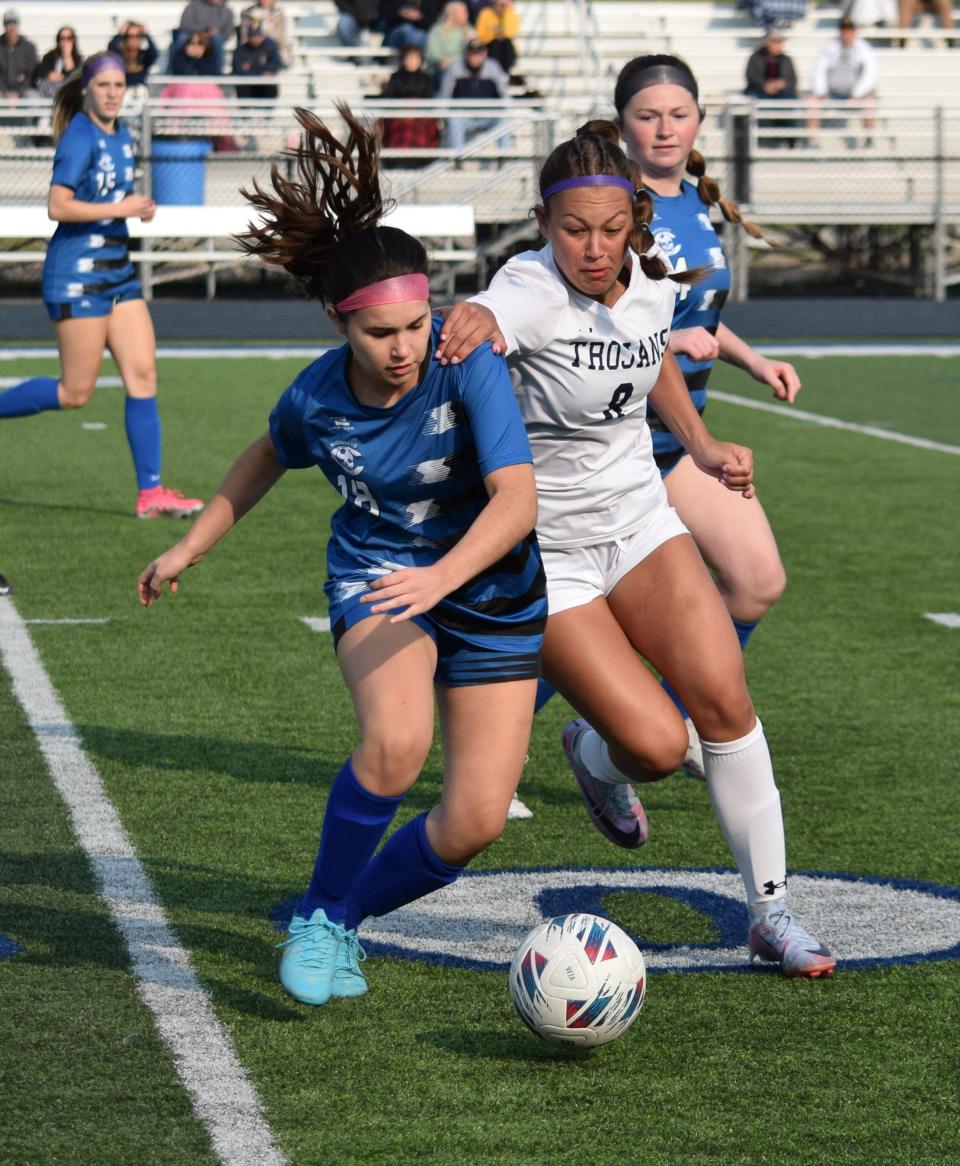 Morgan Ross of Gibraltar Carlson (left) battled Claire Gonyea of Trenton for the ball Wednesday night during a 2-0 Trenton win.