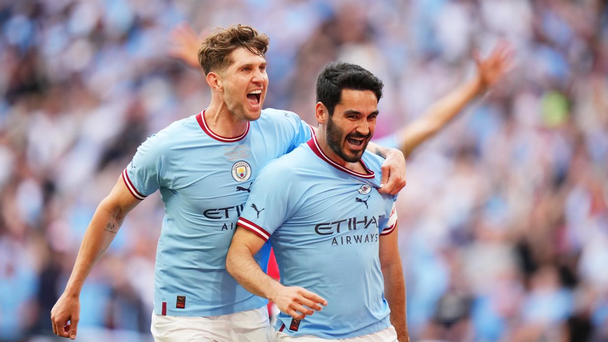  Ilkay Guendogan of Manchester City celebrates with teammate John Stones ahead of the 2023 Champions League Final   